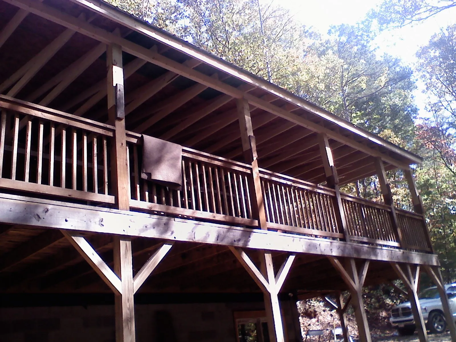 Timber framing under a new elevated porch and deck — Roof Leak Repair in Webster City by Roofing Brothers